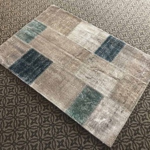 gray patcwork rug