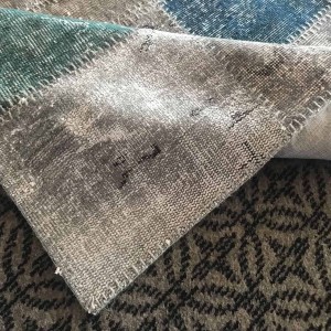 gray patcwork rug